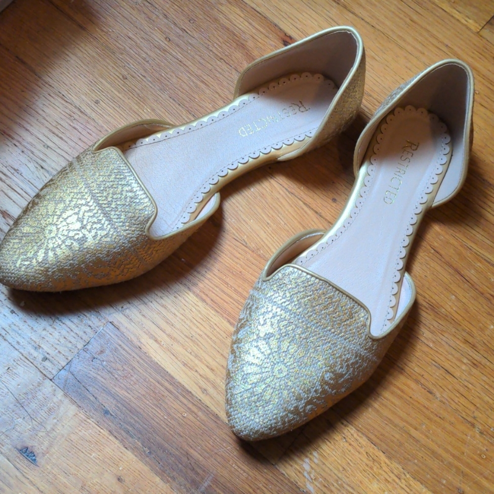 Restricted gold flats size 10
